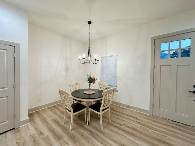 400 N Kenny Dr, West Tawakoni, TX 75474 - dining space with a chandelier, light wood finished floors, and baseboards