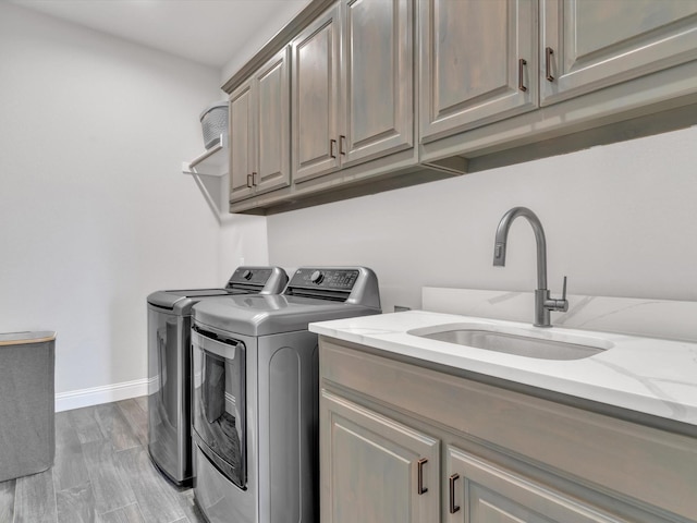 3025 Infinity Dr, Weatherford, TX 76087 - laundry area with washing machine and dryer, cabinet space, and baseboards