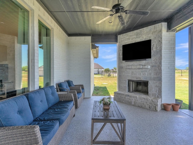 3025 Infinity Dr, Weatherford, TX 76087 - view of patio / terrace featuring a ceiling fan and an outdoor living space with a fireplace