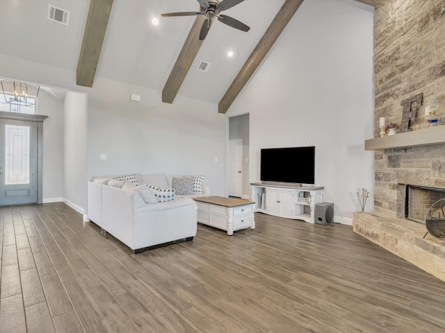 3025 Infinity Dr, Weatherford, TX 76087 - living area with wood finished floors, high vaulted ceiling, beamed ceiling, baseboards, and a ceiling fan