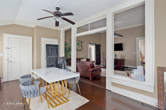 530 Kirby Pl, Shreveport, LA 71104 - dining area featuring ceiling fan, ornamental molding, a barn door, lofted ceiling, and dark wood-style flooring