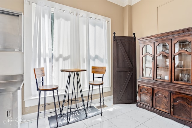 530 Kirby Pl, Shreveport, LA 71104 - sitting room with a barn door, light marble finish flooring, and crown molding