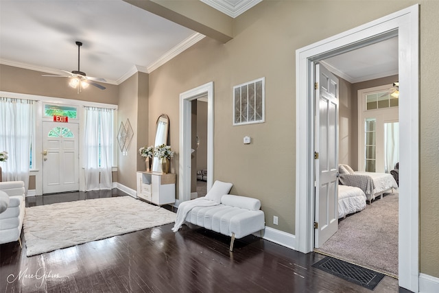 530 Kirby Pl, Shreveport, LA 71104 - foyer entrance with a ceiling fan, crown molding, dark wood-style floors, and baseboards
