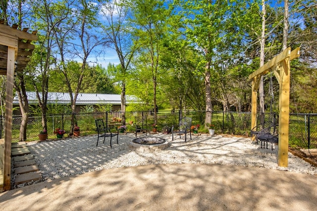 213 County Road 1407, Jacksonville, TX 75766 - view of patio / terrace with a fire pit