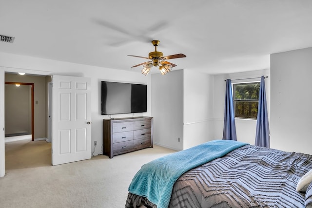 213 County Road 1407, Jacksonville, TX 75766 - bedroom featuring light colored carpet, a ceiling fan, and baseboards