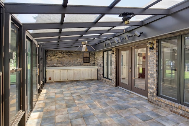 213 County Road 1407, Jacksonville, TX 75766 - unfurnished sunroom with french doors, a ceiling fan, and lofted ceiling