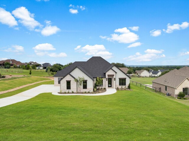 213 Martin Dr, Granbury, TX 76049 - view of front facade featuring a residential view, stone siding, and a shingled roof
