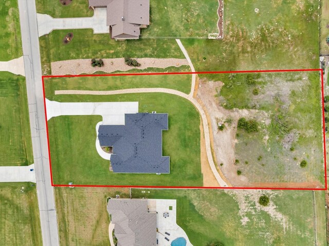 213 Martin Dr, Granbury, TX 76049 - aerial view of residential area featuring a nearby body of water and property boundaries highlighted