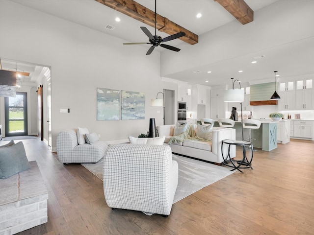 213 Martin Dr, Granbury, TX 76049 - living area with light wood-style floors, beam ceiling, a ceiling fan, recessed lighting, and baseboards