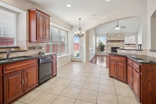 9004 Mcfarland Way, Fort Worth, TX 76244 - kitchen featuring dishwasher, ceiling fan, a fireplace, a sink, and light tile patterned flooring