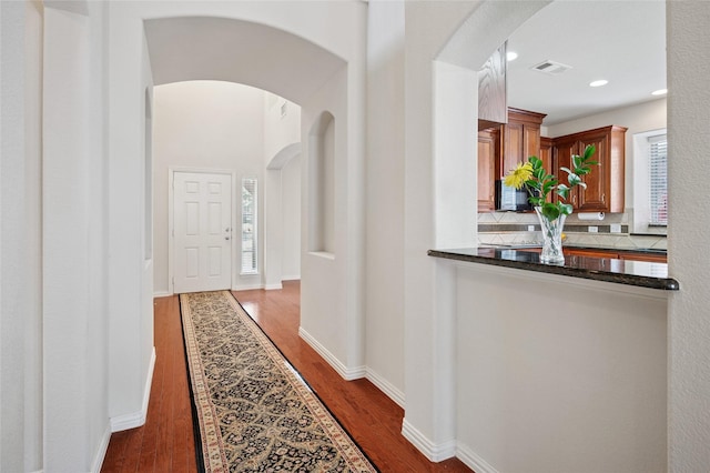 9004 Mcfarland Way, Fort Worth, TX 76244 - hall with arched walkways, dark wood-type flooring, recessed lighting, and baseboards