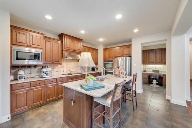 1036 Knoxbridge Rd, Forney, TX 75126 - kitchen with appliances with stainless steel finishes, tasteful backsplash, a breakfast bar area, light stone counters, and recessed lighting