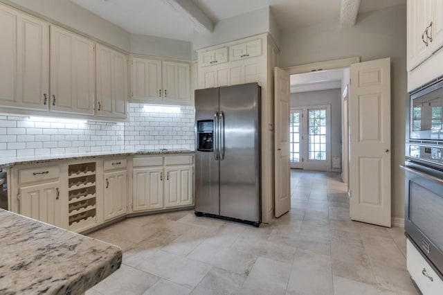 4713 N O Connor Ct, Irving, TX 75062 - kitchen with stainless steel appliances, backsplash, plenty of natural light, light stone counters, and beamed ceiling