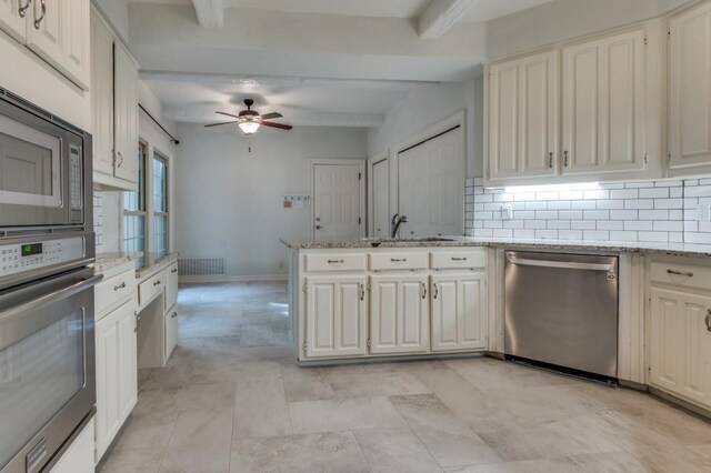 4713 N O Connor Ct, Irving, TX 75062 - kitchen with stainless steel appliances, beamed ceiling, decorative backsplash, ceiling fan, and a sink