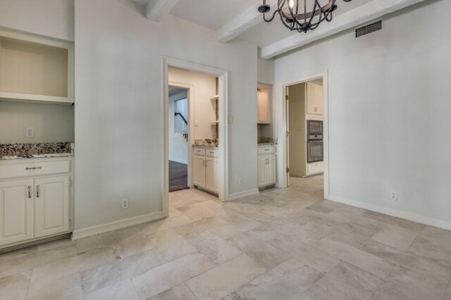 4713 N O Connor Ct, Irving, TX 75062 - unfurnished dining area with a chandelier, beam ceiling, and baseboards