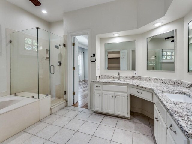 4713 N O Connor Ct, Irving, TX 75062 - bathroom with a stall shower, double vanity, plenty of natural light, a ceiling fan, and recessed lighting