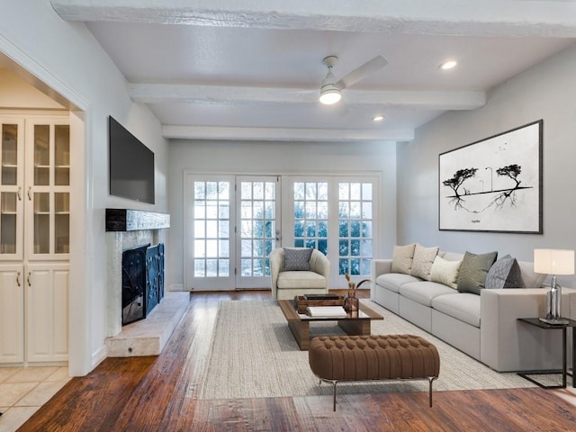 4713 N O Connor Ct, Irving, TX 75062 - living room with beamed ceiling, a ceiling fan, wood finished floors, a premium fireplace, and recessed lighting