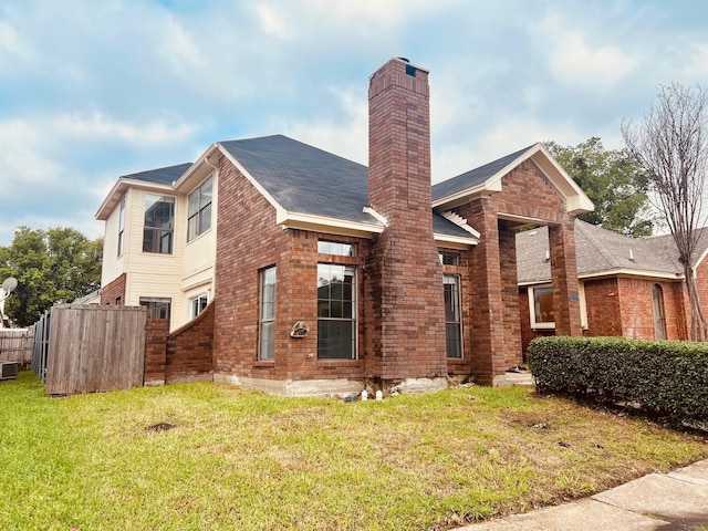 1737 Liberty Ln, Mesquite, TX 75149 - view of front of house featuring a chimney, brick siding, and cooling unit