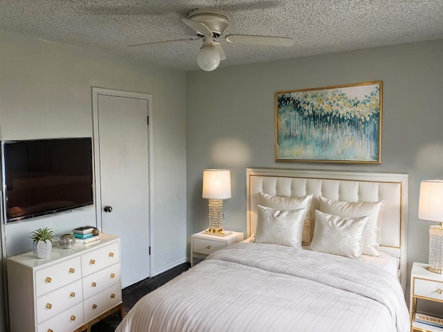 1737 Liberty Ln, Mesquite, TX 75149 - bedroom featuring ceiling fan, a textured ceiling, and dark colored carpet