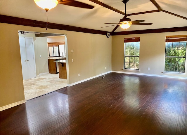 2512 Lawndale Dr, Plano, TX 75023 - spare room with a ceiling fan, baseboards, wood-type flooring, and lofted ceiling