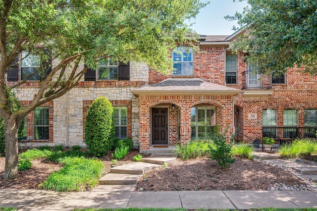 393 Bluebird Ln, Fairview, TX 75069 - view of front of home with stone siding, brick siding, and roof with shingles