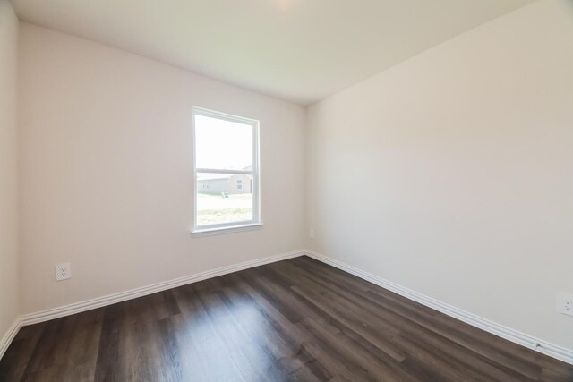 471 Bobbie St, Mabank, TX 75147 - spare room featuring dark wood-type flooring and baseboards