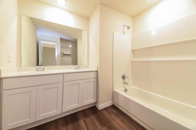 471 Bobbie St, Mabank, TX 75147 - full bathroom with bathing tub / shower combination, double vanity, wood finished floors, and baseboards