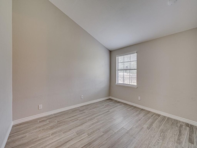 4241 Malone Ave, The Colony, TX 75056 - empty room featuring light wood-type flooring, baseboards, and lofted ceiling