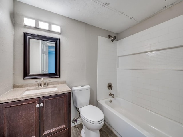 4241 Malone Ave, The Colony, TX 75056 - bathroom with toilet, wood finished floors, vanity, shower / tub combination, and a textured wall
