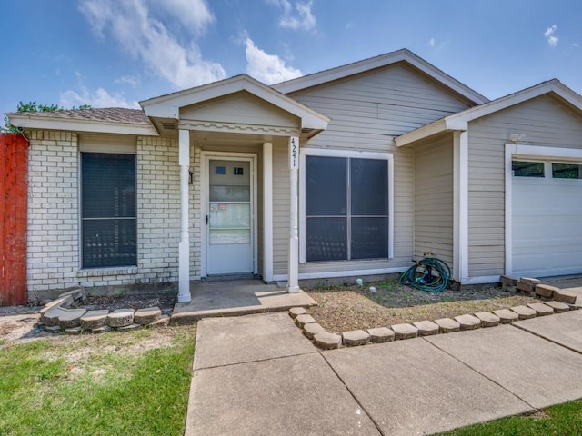 4241 Malone Ave, The Colony, TX 75056 - view of front of house featuring brick siding and a garage