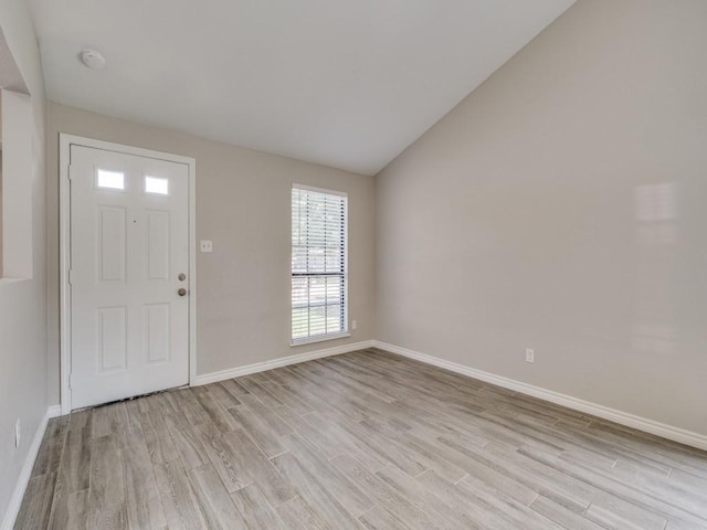 4241 Malone Ave, The Colony, TX 75056 - foyer entrance with light wood-type flooring, baseboards, and vaulted ceiling