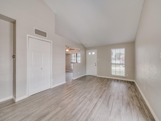 4241 Malone Ave, The Colony, TX 75056 - unfurnished living room with vaulted ceiling, light wood-style floors, baseboards, and a ceiling fan