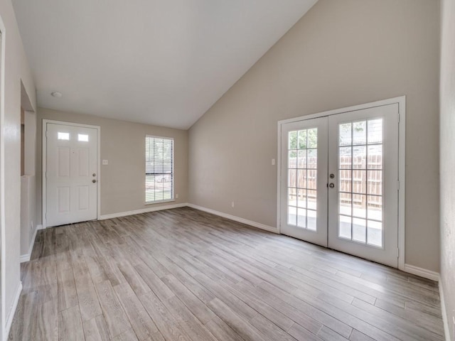 4241 Malone Ave, The Colony, TX 75056 - foyer entrance featuring french doors, plenty of natural light, light wood finished floors, and high vaulted ceiling