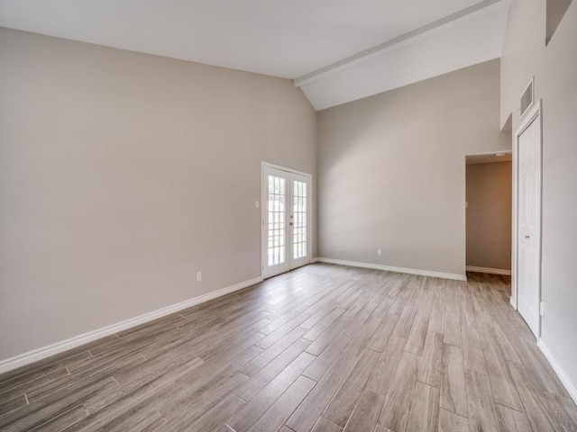 4241 Malone Ave, The Colony, TX 75056 - empty room featuring french doors, light wood finished floors, high vaulted ceiling, and baseboards