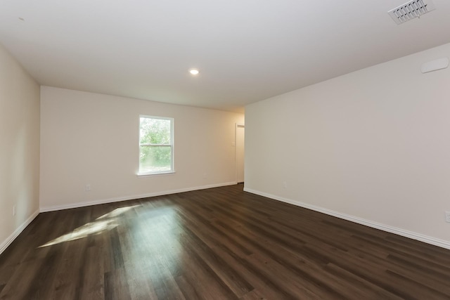 825 Garrison St, Waco, TX 76704 - spare room featuring dark wood-style floors, baseboards, and recessed lighting