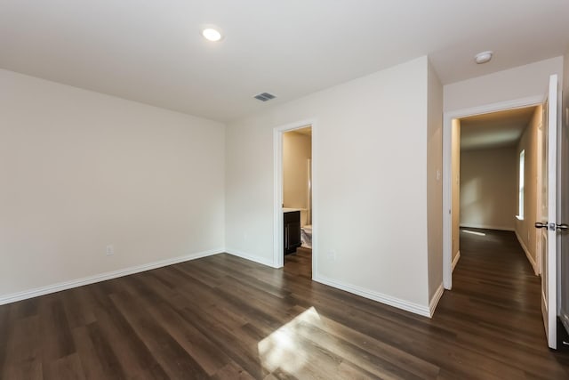 825 Garrison St, Waco, TX 76704 - spare room with baseboards, dark wood finished floors, a smoke detector, and recessed lighting