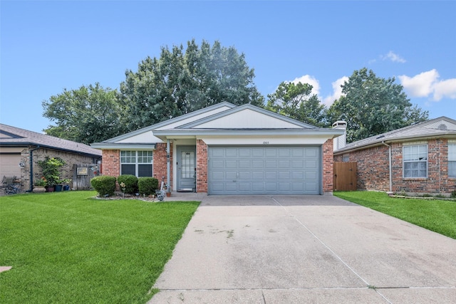 1005 Blue Jay Dr, Mansfield, TX 76063 - single story home featuring concrete driveway, a garage, and brick siding