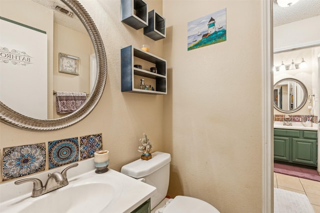 1005 Blue Jay Dr, Mansfield, TX 76063 - bathroom with tile patterned flooring, vanity, and a textured ceiling