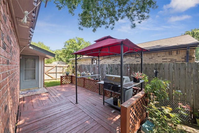 1005 Blue Jay Dr, Mansfield, TX 76063 - wooden deck with a gazebo, a fenced backyard, and a grill