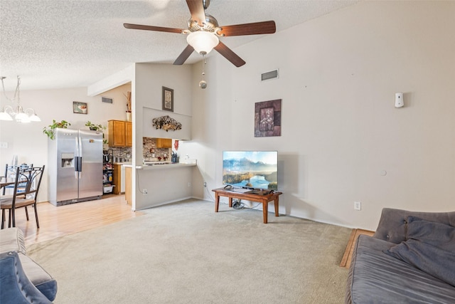 1005 Blue Jay Dr, Mansfield, TX 76063 - living room featuring lofted ceiling, a chandelier, light carpet, ceiling fan, and a textured ceiling