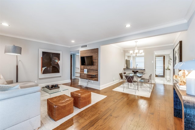 10203 Regal Oaks Dr Unit 202, Dallas, TX 75230 - living room with a chandelier, wood finished floors, crown molding, baseboards, and recessed lighting