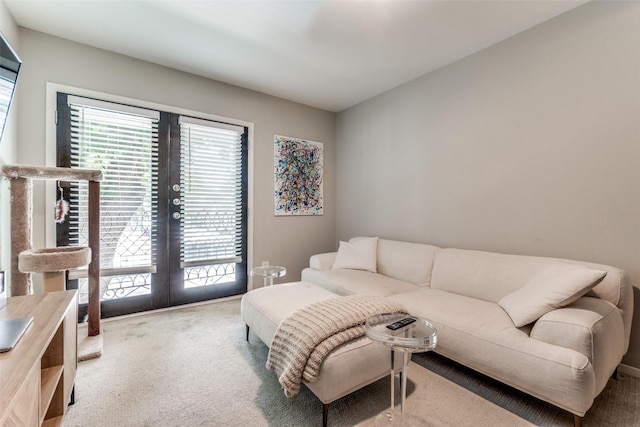 10203 Regal Oaks Dr Unit 202, Dallas, TX 75230 - living room featuring light colored carpet, healthy amount of natural light, and french doors