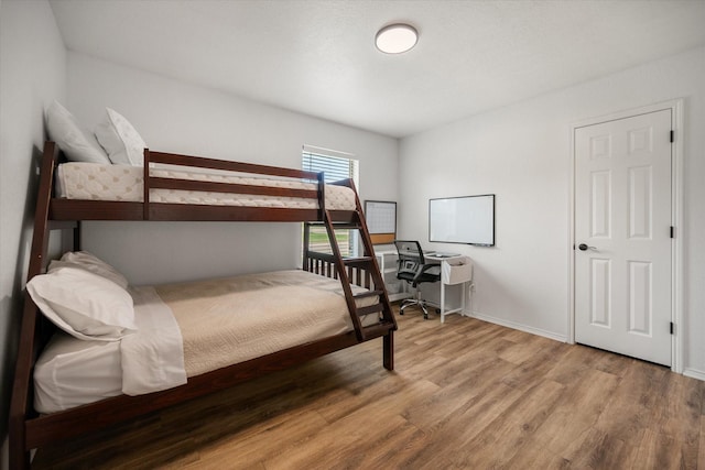 800 Bur Oak Dr, Burleson, TX 76028 - bedroom featuring wood finished floors and baseboards