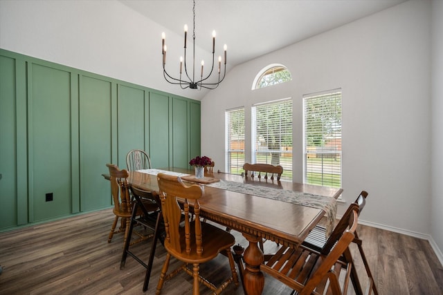 800 Bur Oak Dr, Burleson, TX 76028 - dining space with a chandelier, dark wood-style floors, a decorative wall, and vaulted ceiling
