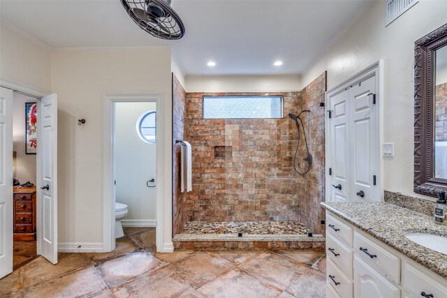 813 Singing Hills Dr, Garland, TX 75044 - full bathroom featuring tiled shower, vanity, crown molding, and toilet