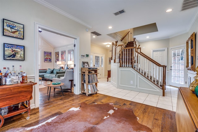 813 Singing Hills Dr, Garland, TX 75044 - foyer entrance featuring stairway, wood finished floors, healthy amount of natural light, and crown molding