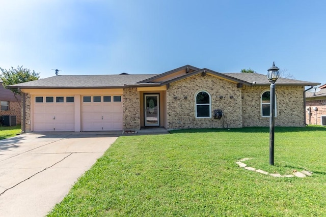 4501 Mink Dr, Haltom City, TX 76117 - ranch-style home featuring a garage, driveway, a front lawn, central AC, and brick siding