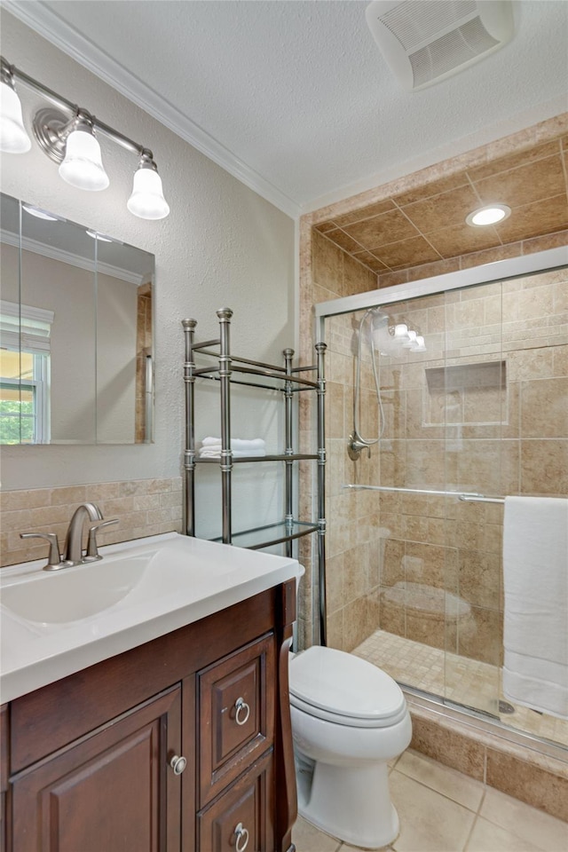 4501 Mink Dr, Haltom City, TX 76117 - full bath featuring ornamental molding, vanity, toilet, a stall shower, and tile patterned floors