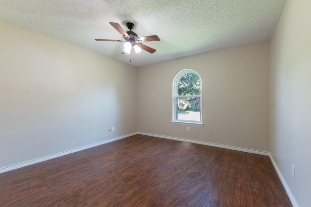 4501 Mink Dr, Haltom City, TX 76117 - empty room with wood finished floors, a ceiling fan, a textured ceiling, and baseboards