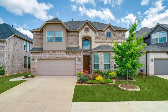 1225 Horsemint Dr, Little Elm, TX 75068 - french country inspired facade featuring brick siding, concrete driveway, a garage, and a front lawn